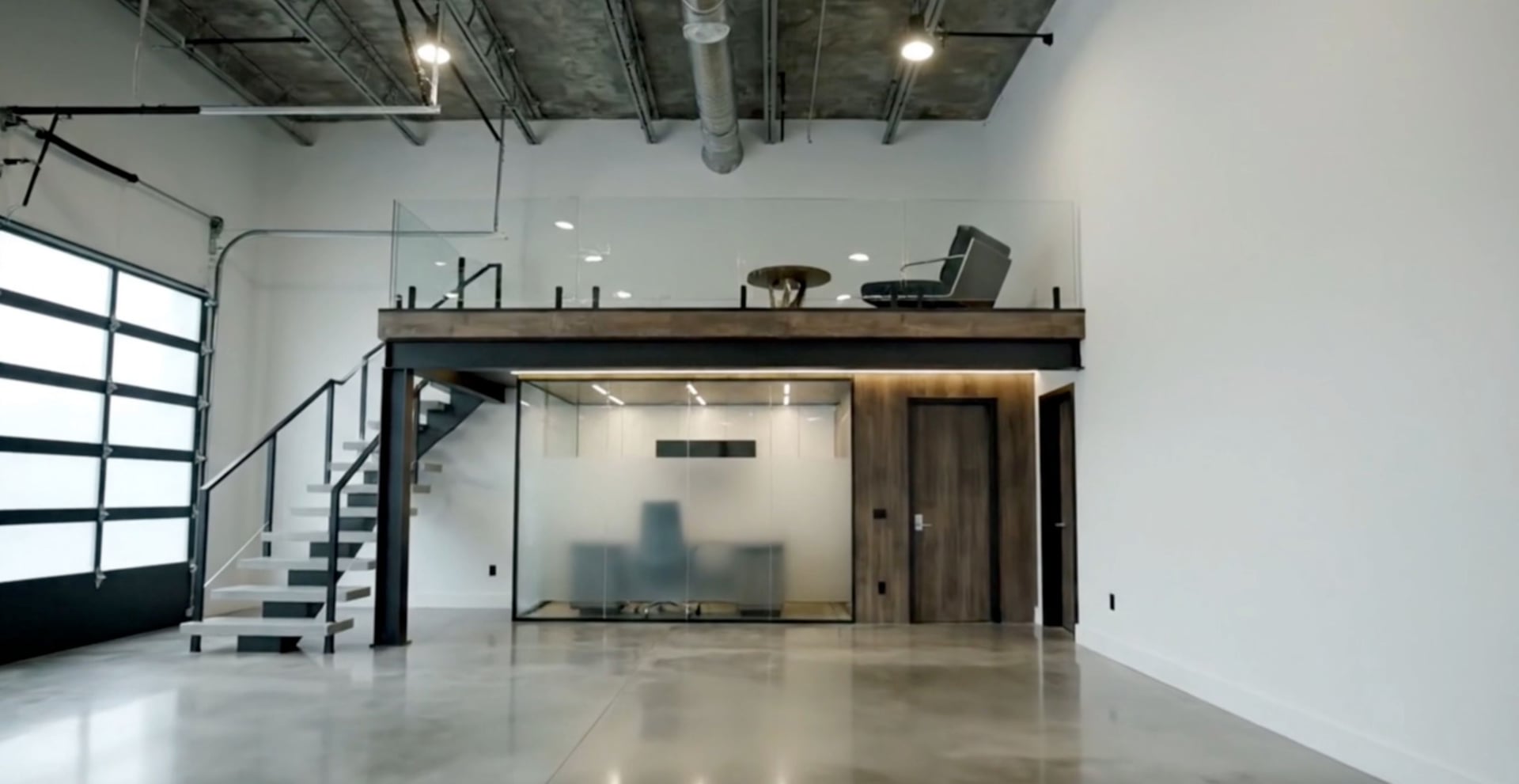Custom garage layout with mezzanine level, personalized storage solutions, and flexible design options